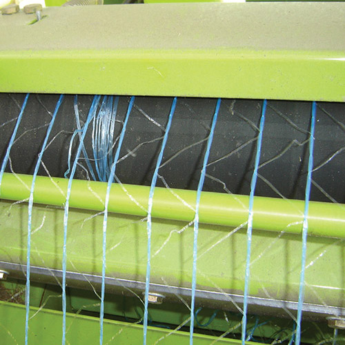 Net wrapping on feeding rollers